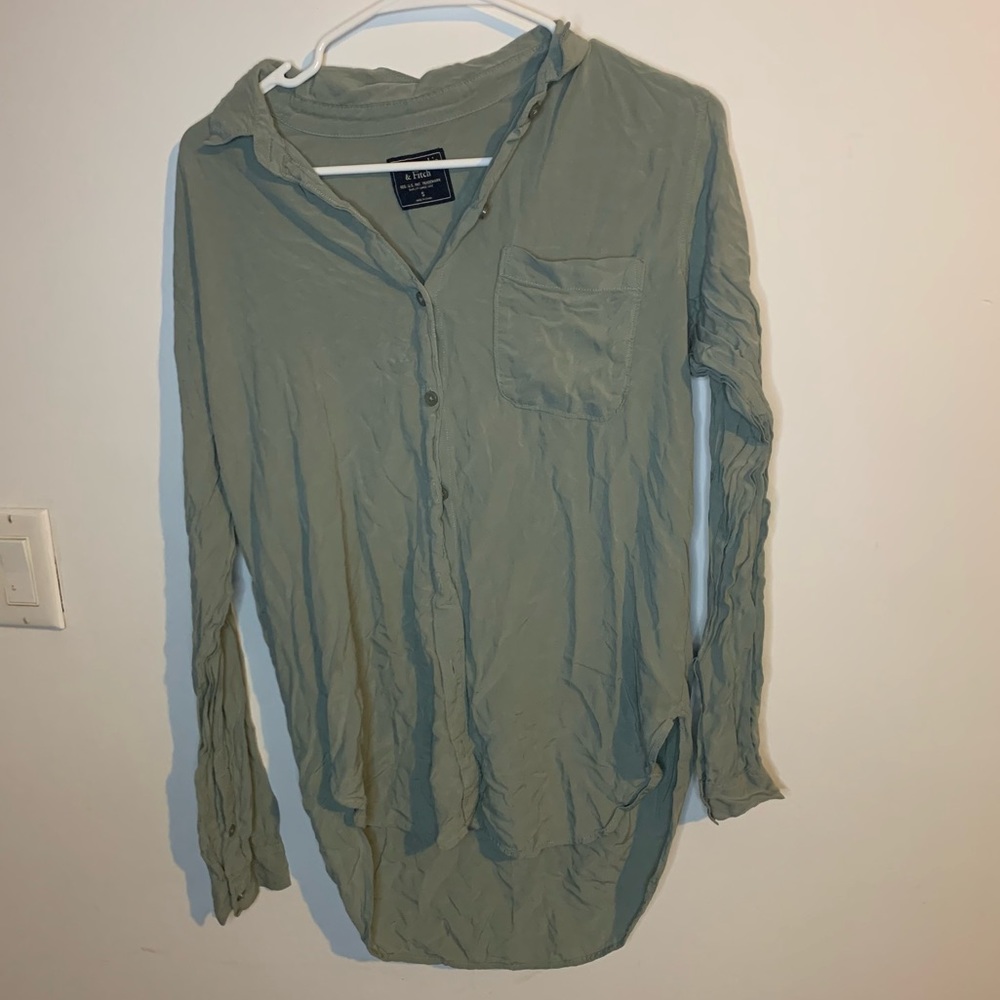 Green button up shirt